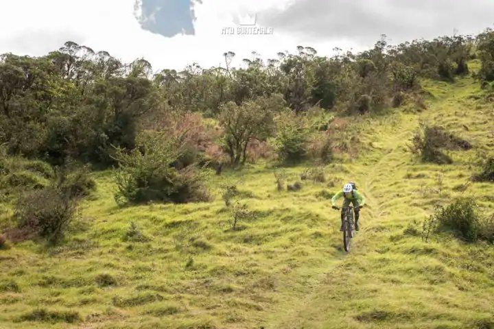 Riding in the alpine Grass.  Valle Escondido Adventure MTB Tour  Chimaltenango, Guatemala