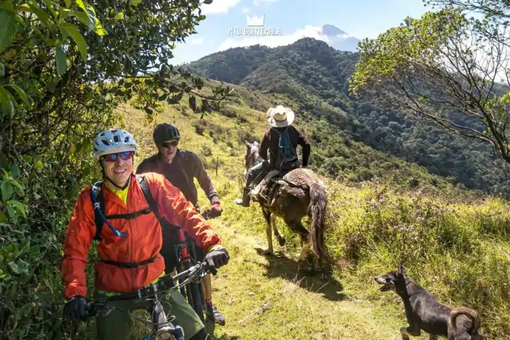 Farmer heads to the fields. Volcán Acatenango (3976m)  behind.  Valle Escondido Adventure MTB Tour  Chimaltenango, Guatemala