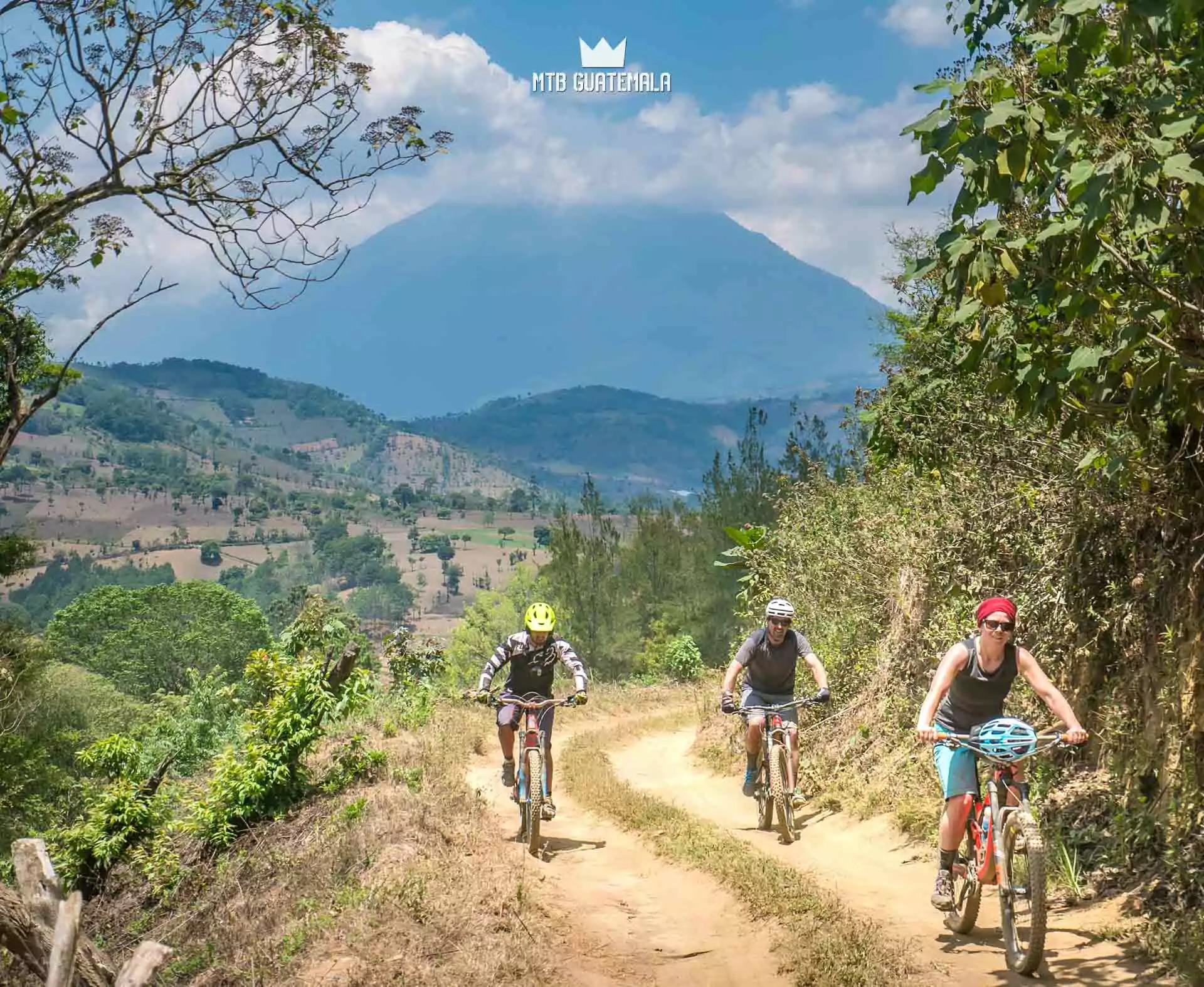 Climbing through avocado orchards - Acatenango volcano behind. Dos Aguacates enduro tour.  Sacatepéquez, Guatemala