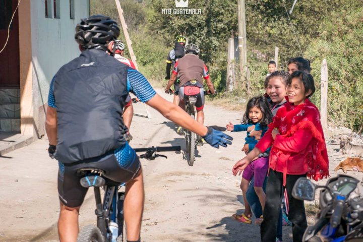 Communities come out to cheer the riders on in the 9th for the 9th edition of the Travesía de Los Cuchumatanes. comunidad san sebastian martir Huehuetenango, Guatemala