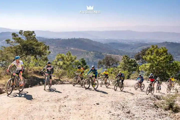 Riders make thier way up the 4,000ft climb with views of northern Guatemala Below.  Huehuetenango, Guatemala