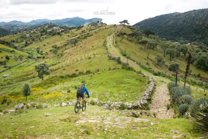 Mountain Biking in the Cuchumatánes - Following rocky sheep herding paths on the alpine plateau.  Trails here are lined with enormous agave plants. Los Cuchumatánes Huehuetenango, Guatemala